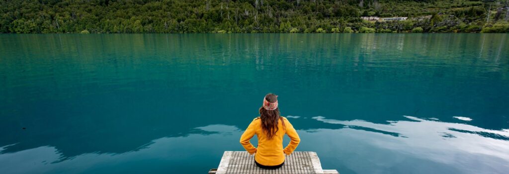 lady-sitting-at-lake